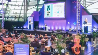 Audience watches a presentation on the main stage at the Toy Business Forum.